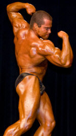 Lee Hayward - Twisting Back Bicep Pose