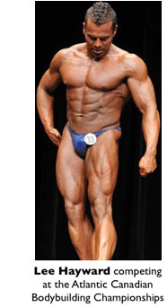 Lee Hayward flexing his quads on stage at the Atlantic Canadian Bodybuilding Championships
