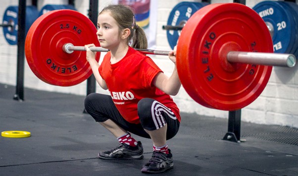 Young Girl Weight Lifting Squat